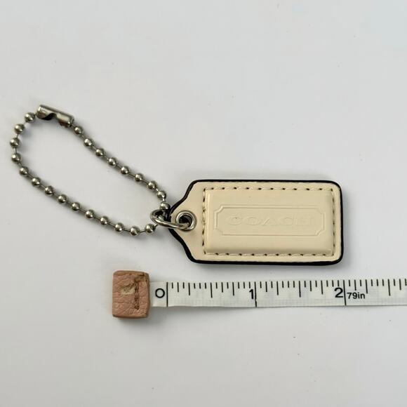 Coach ivory patent leather key fob bag charm hangtag silver-tone hardware 2” - Picture 2 of 5